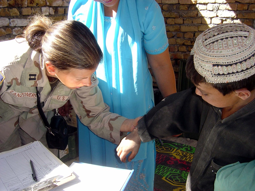 Army Nurse Provides Medical Care to Afghan Boy