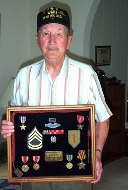 WWII D-Day Veteran Displays Medals for Gallantry in Combat