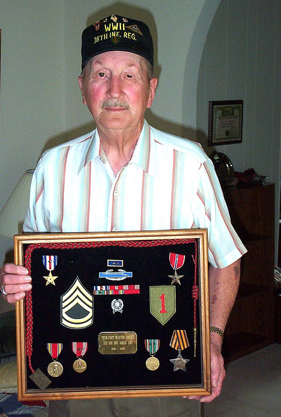 WWII D-Day Veteran Displays Medals for Gallantry in Combat