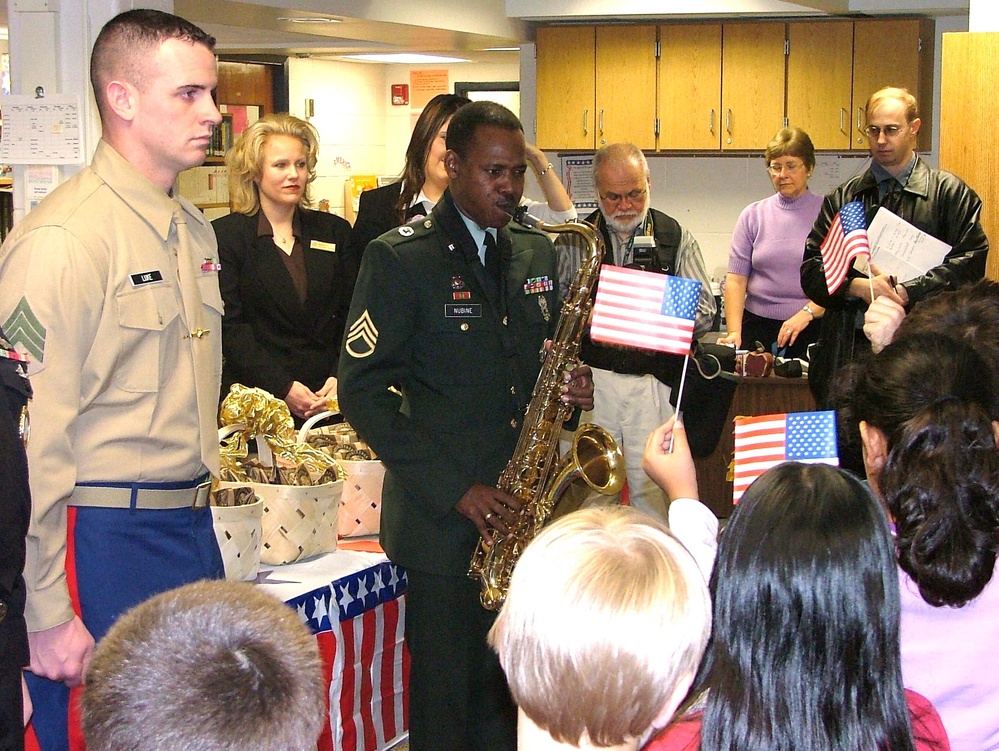 Army Recruiter Plays National Anthem as Marine Recruiter Stands at Attention