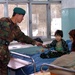 Afghan Soldier Brings Comfort to Hospitalized Child in Kabul