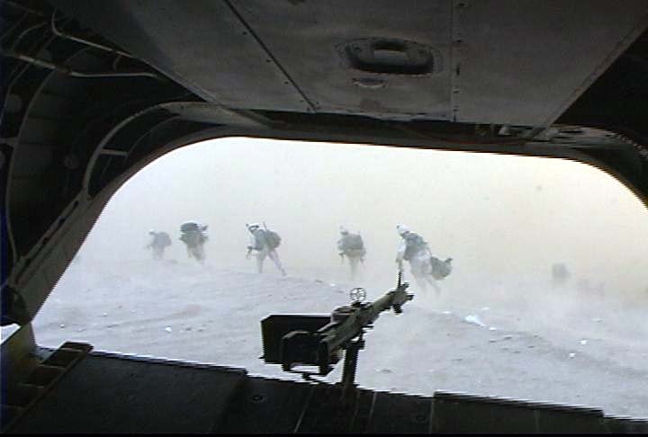 Soldiers Rush from Aircraft in Combat Air Assault