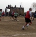 Afghan Player Dribbles Past Coalition Defenders in Match