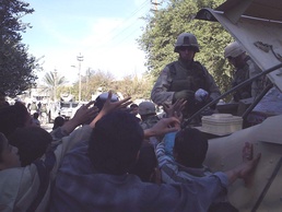 Soldiers Distribute Frozen Chickens to Iraqi Citizens in Sadr City