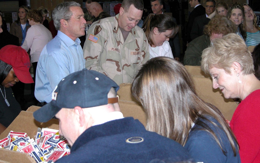 Bush Joins USO Volunteers Packing Care Packages for Troops Overseas