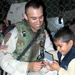 Soldier Brings Joy to Orphaned Child During Humanitarian Mission