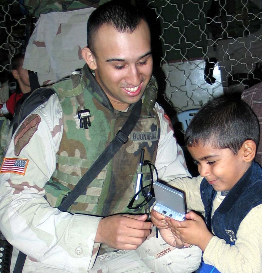 Soldier Brings Joy to Orphaned Child During Humanitarian Mission