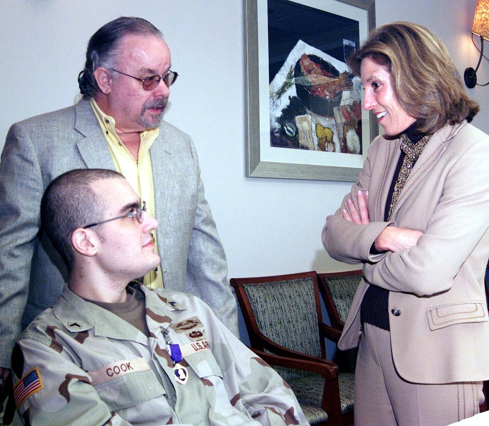 Army Cpl. Eli F. Cook Receives Purple Heart, Meets 9/11 Widow