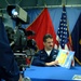 Navy Petty Officer 1st Class Reads Aboard USS Peleliu