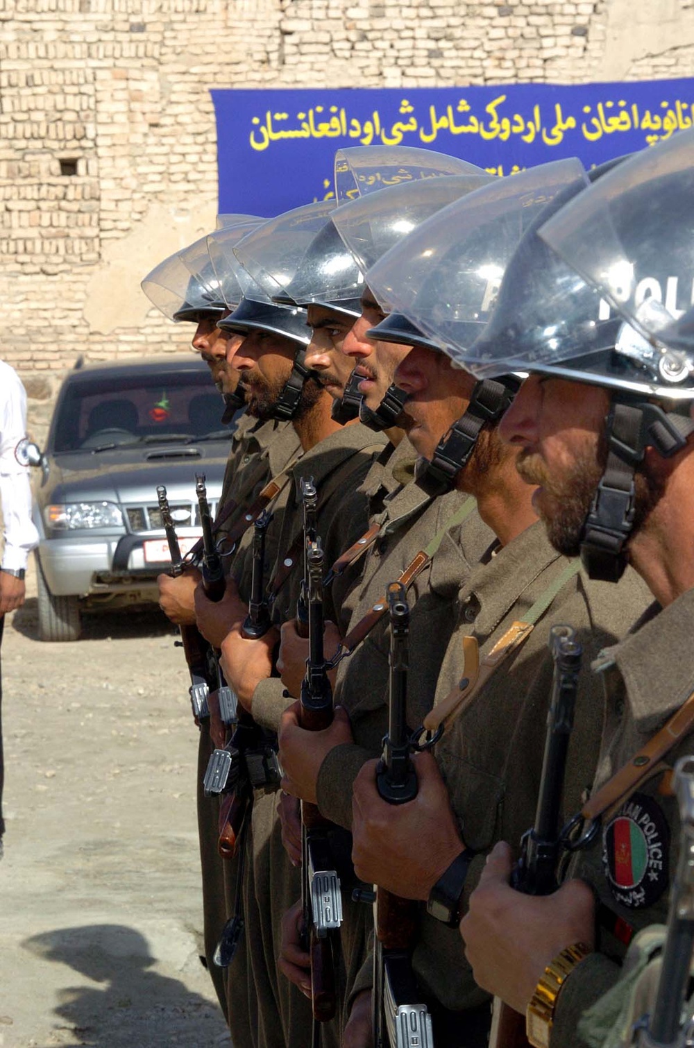 Afghan Police Honor Guard Raises National Flag
