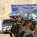 Afghan Police Honor Guard Raises National Flag