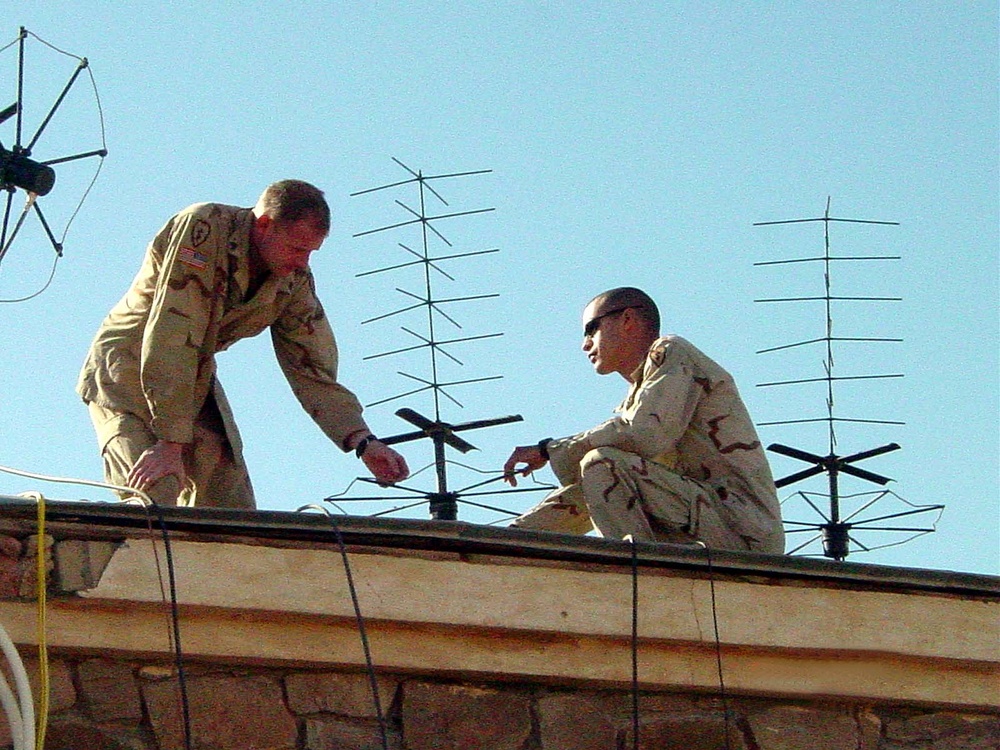 Army Sergeants Set Up Tactical Satellite Antenna in Afghanistan