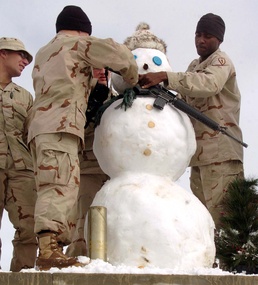 Soldiers Build Snowman Amid Snowy Conditions at Afghan Base
