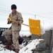 Medic Shovels Snow at Forward Operating Base in Afghanistan