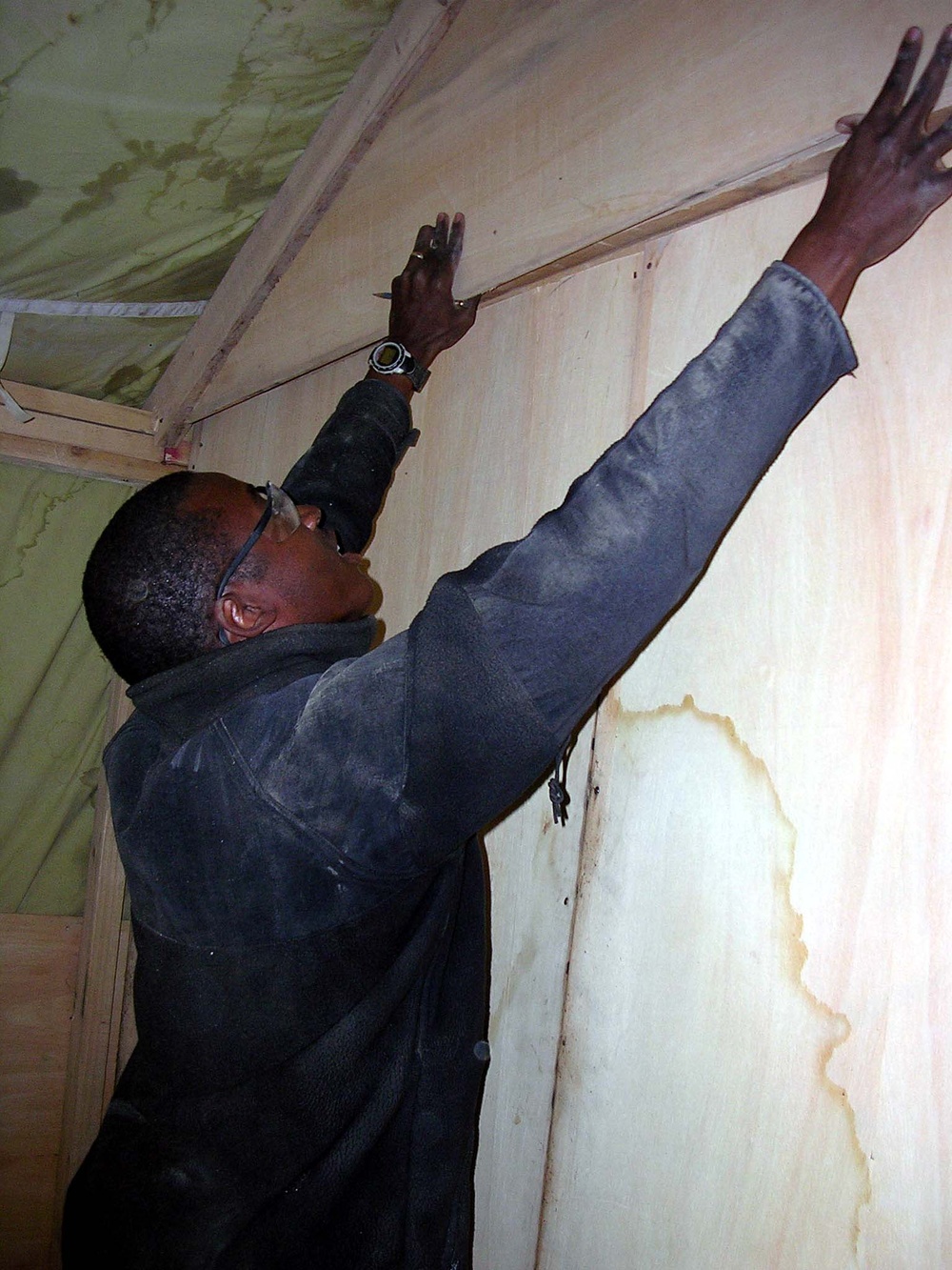 Soldier Constructs Wall in Living Quarters at Afghan Forward Operating Base