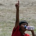 Young Boy Quenches Thirst After Earthquake and Tsunami in Sumatra