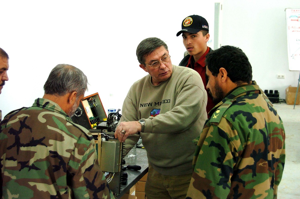 U.S. Project Manager Trains Afghan Communications Officer on Equipment Maintenance