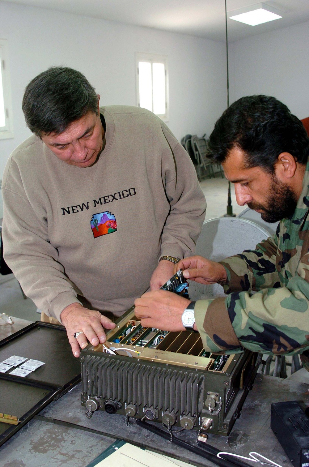 Datron World Communications Project Manager Trains Afghan Technicians on Radio Repair