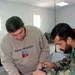 Datron World Communications Project Manager Trains Afghan Technicians on Radio Repair
