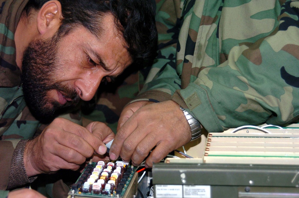 Afghan Defense Official Inspects Radio Component