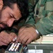 Afghan Defense Official Inspects Radio Component