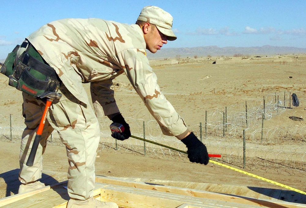 Army Carpenter Measures Guard Tower at Firebase Waza Khwa