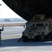 Airman Guides Humvee Off C-17 at Bagram Airfield