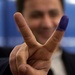 Iraqi Voter Celebrates Casting Ballot in U.S. Absentee Election
