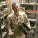 Marine Sergeant Maintains Cryptological Gear in Wire Cage