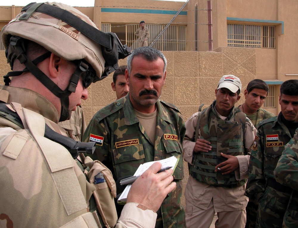 U.S. Army Captain Assists Iraqi Security Forces at Polling Station