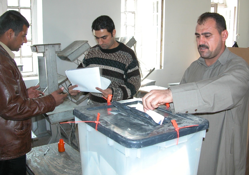 Voter Casts Ballot at Rusafa Polling Station