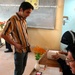 Election Officials Process Voter at Zafaraniya Polling Station