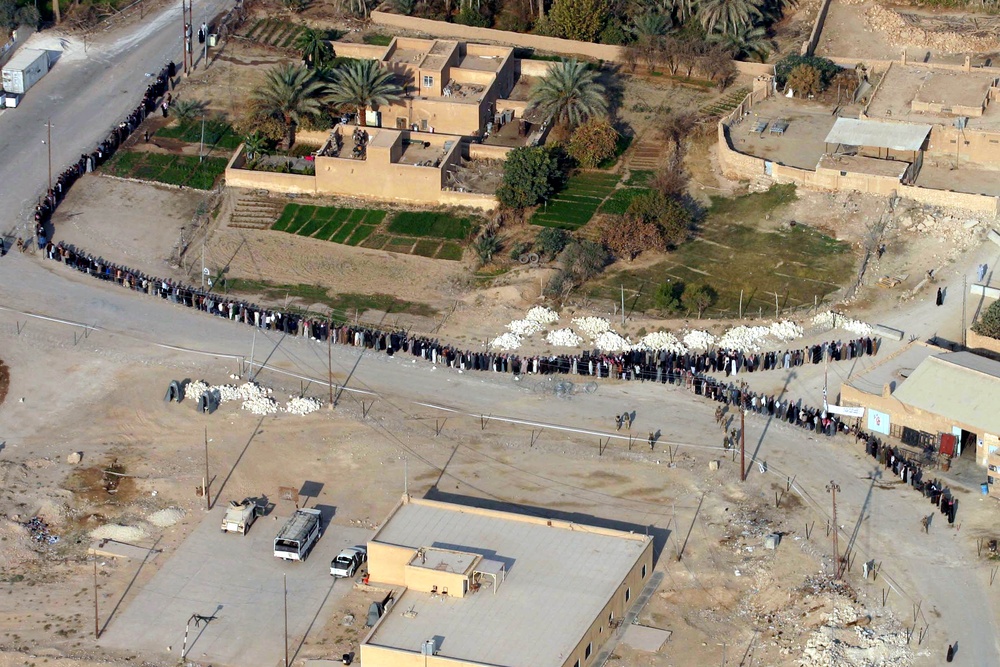 Iraqi Voters Flock to Polls for Historic Parliamentary Election
