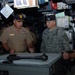 Navy Commander Explains Weapons Systems to Army Senior Enlisted Advisor