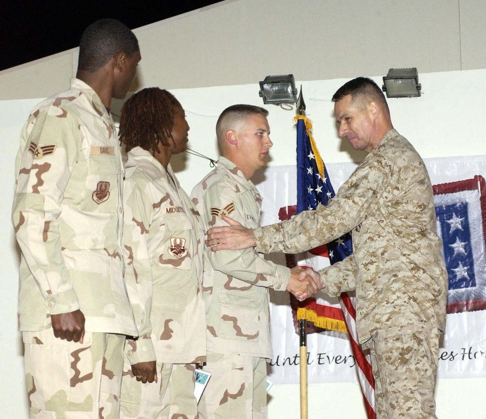 Top U.S. General Re-Enlists Airmen at Qatar Air Base