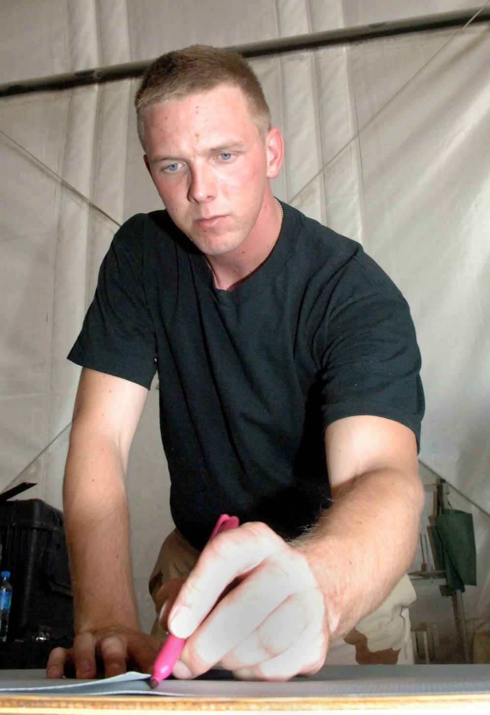 Air Force Airman Prepares Protective Engine Cover