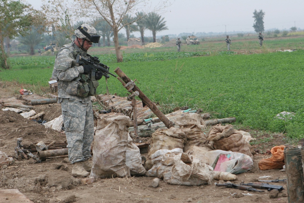 Soldiers Uncover Weapons Cache West of Baghdad