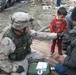 Medic Tends to Injuries After Baghdad Car Bombings