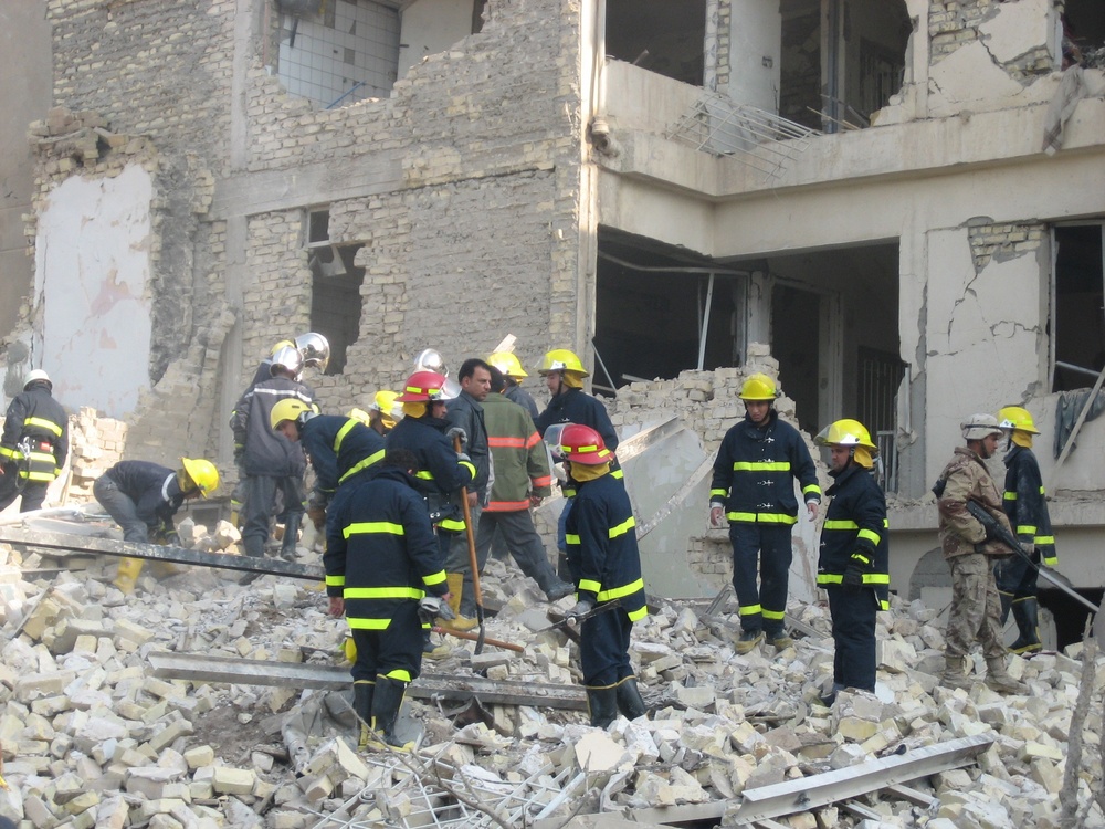 Iraqi Firefighters Rescue Trapped Residents After Deadly Baghdad Bombings