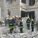 Iraqi Firefighters Rescue Trapped Residents After Deadly Baghdad Bombings
