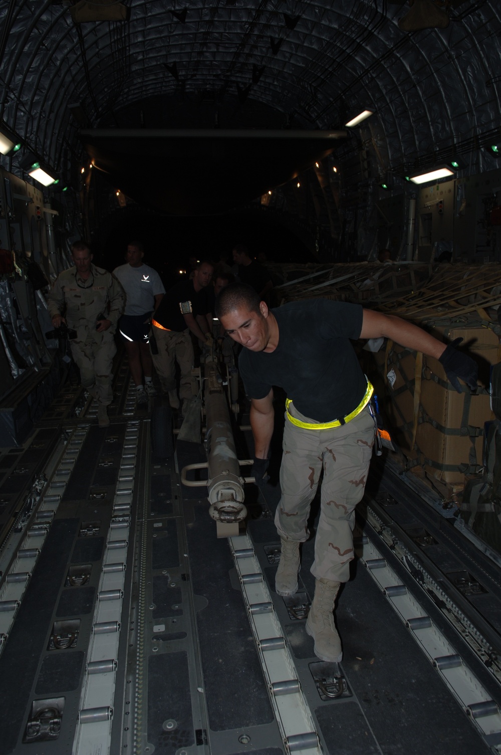 Air Force Airman Helps Load Relief Supplies for Pakistan