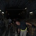 Air Force Airman Helps Load Relief Supplies for Pakistan