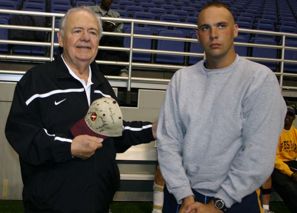 Wounded Soldier Presents Saints Owner with Autographed Hat