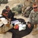 Airborne Infantry Officer Distributes Supplies to Afghan Villagers