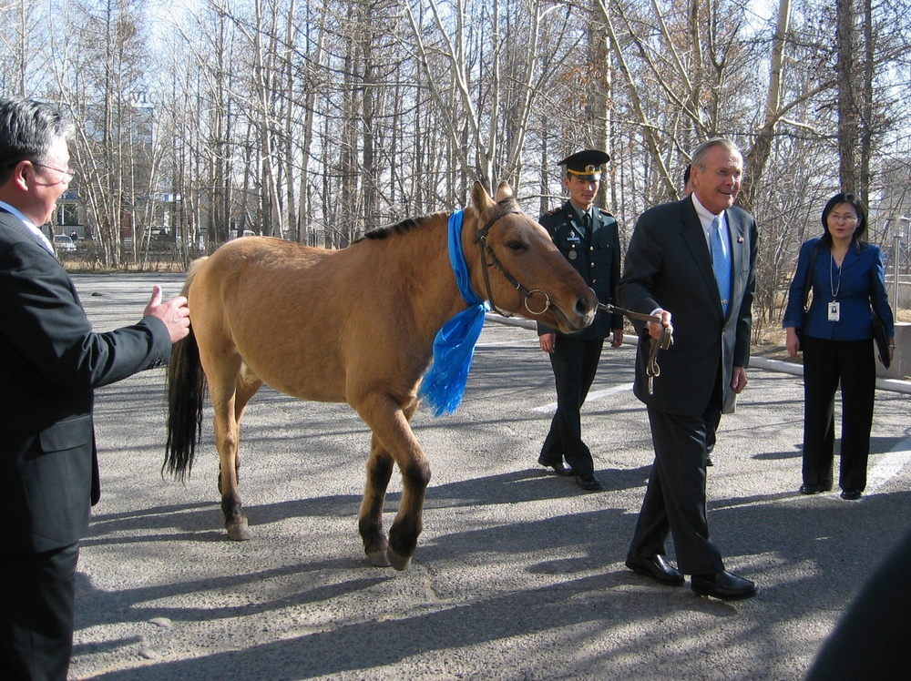 Rumsfeld Rides Horse Named Montana in Mongolia