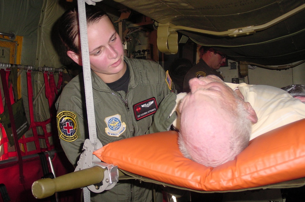 Air Force Medic Comforts Evacuee During Gulf Coast Airlift