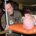 Air Force Medic Comforts Evacuee During Gulf Coast Airlift