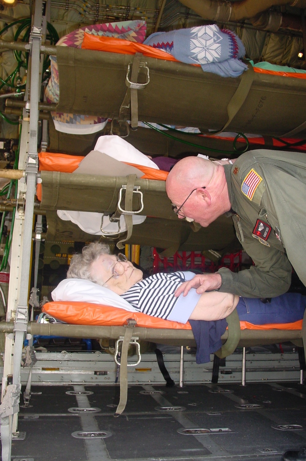 Air Force Medical Provider Attends to Patient During Aeromedical Flight