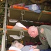 Air Force Medical Provider Attends to Patient During Aeromedical Flight