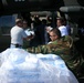 Guardsmen Rush to Load Ice Onto Helicopter Before Midday Heat